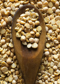 Full frame shot of lentils with wooden spoon