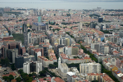 High angle view of buildings in city against sky