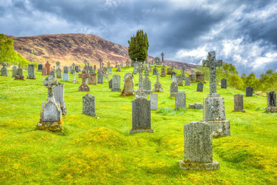 View of cemetery against cloudy sky