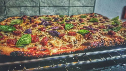 High angle view of pizza on barbecue grill