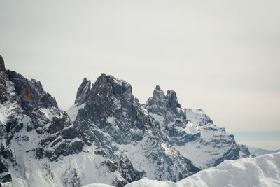 Scenic view of sea and mountains against clear sky