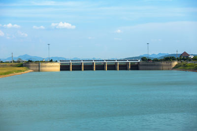 Bridge over sea against sky
