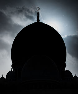 Silhouette of historical building against cloudy sky