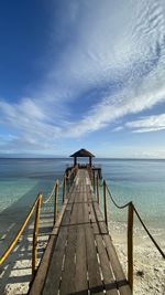 Pier over sea against sky