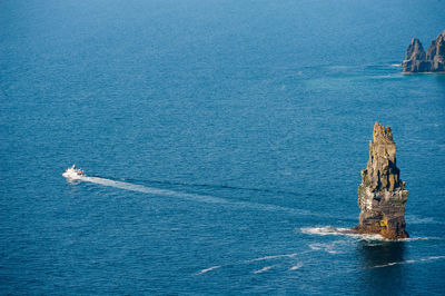 Scenic view of sea against blue sky