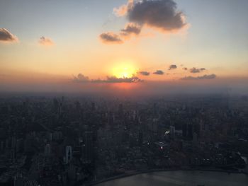 High angle view of buildings against sky during sunset