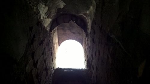 Low angle view of illuminated tunnel