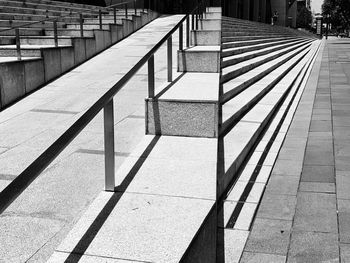 Shadow of railing on footpath