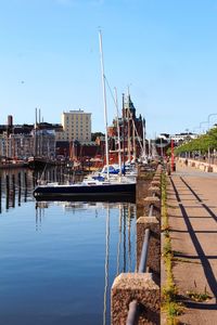 Boats moored at harbor