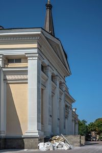 Low angle view of historic building against blue sky