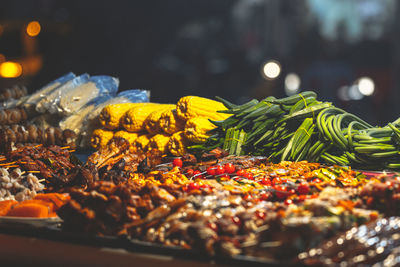 Close-up of chili peppers for sale at market stall