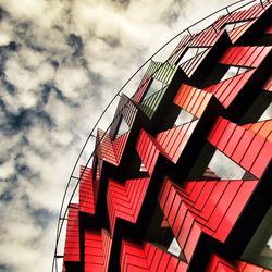 Low angle view of built structure against cloudy sky