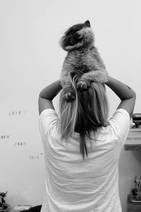 Rear view of woman with umbrella