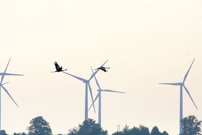 Low angle view of windmill against clear sky