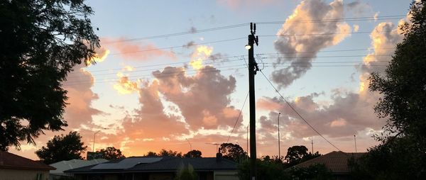 Low angle view of silhouette trees against sky during sunset