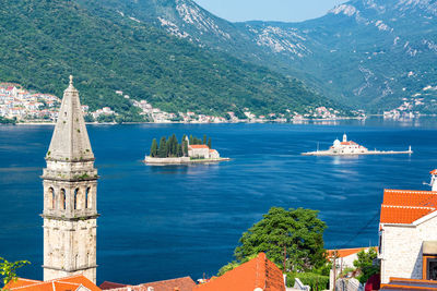 Scenic view of sea against buildings