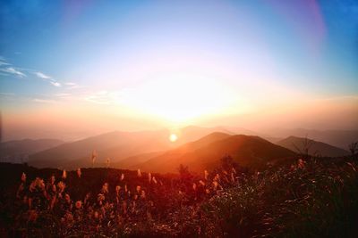 Scenic view of mountains against sky during sunset