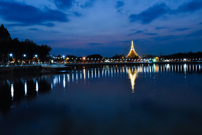 Reflection of illuminated buildings in lake at night