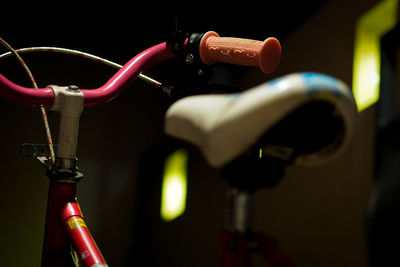 Close-up of bicycle parked on cable