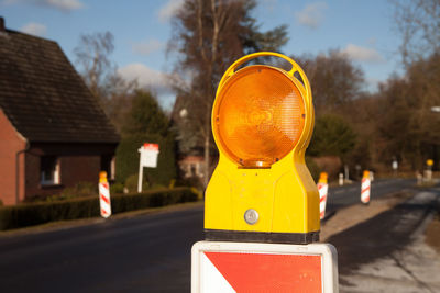 Close-up of road sign against trees