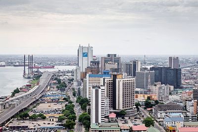 High angle view of buildings in city against sky