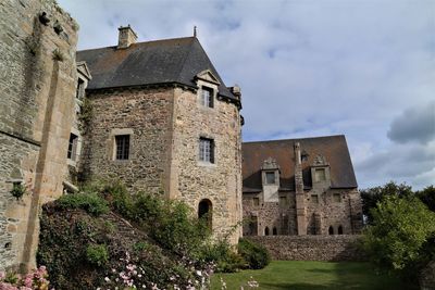 Low angle view of old building against sky