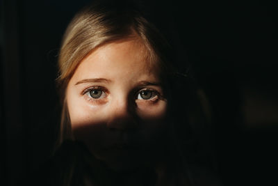 Close-up portrait of a serious young woman