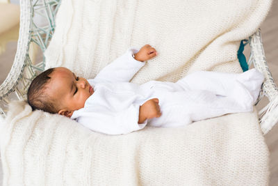 Boy sleeping on bed