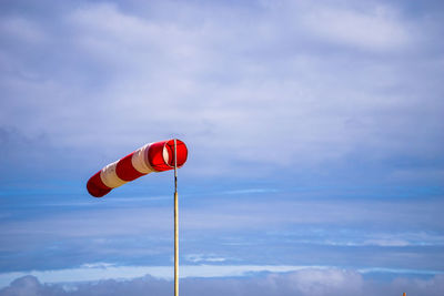 Low angle view of flag against sky