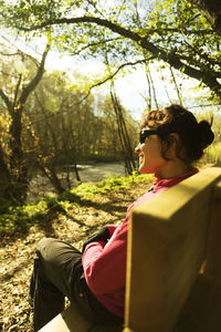 Woman sitting in a forest