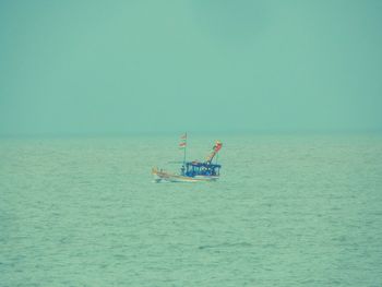 Scenic view of calm sea against clear sky