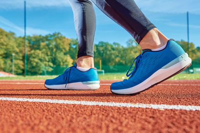 Running sneakers at stadium track