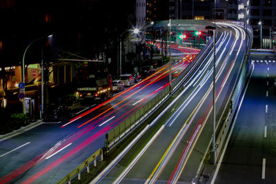 High angle view of light trails on road at night