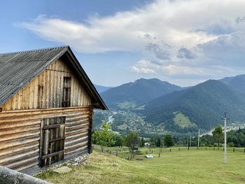 Built structure on landscape against sky