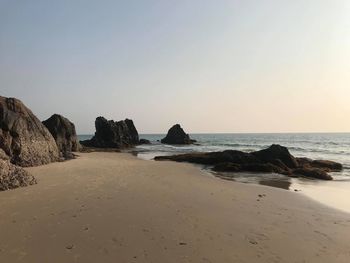 Scenic view of beach against clear sky