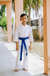 Portrait of boy standing outdoors