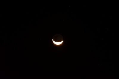 Low angle view of moon against sky at night