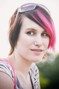 Close-up portrait of woman with dyed hair