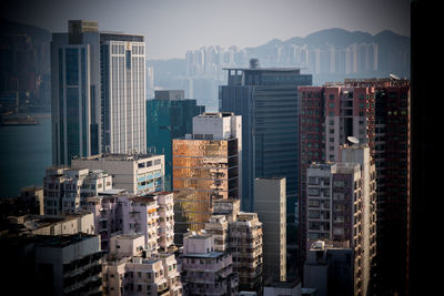 Modern buildings in city against sky