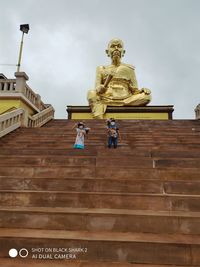 Low angle view of statue against sky