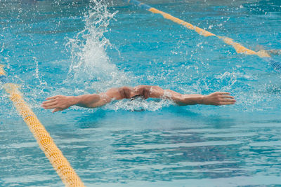 Man swimming in pool