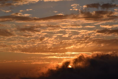 Scenic view of dramatic sky during sunset