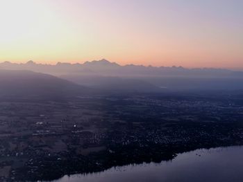 Aerial view of city during sunset