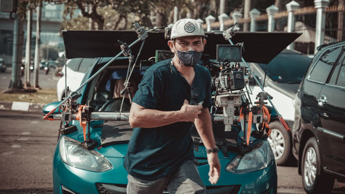 Portrait of man working in car