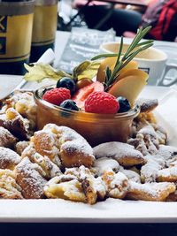 Close-up of fruits in plate on table