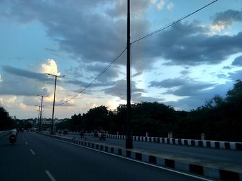 View of road against cloudy sky