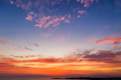 Low angle view of dramatic sky during sunset