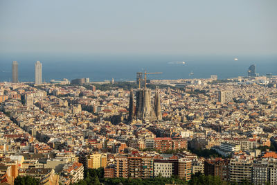 High angle view of city buildings against sky