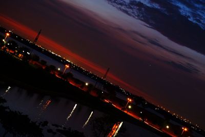 High angle view of illuminated bridge against sky at night