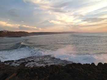 Scenic view of sea against dramatic sky